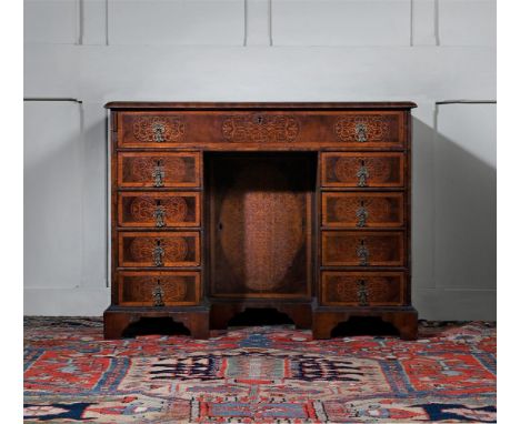 A WILLIAM & MARY WALNUT AND SEAWEED MARQUETRY KNEEHOLE DESK  IN THE MANNER OF GERRIT JENSEN, CIRCA 1690 The seaweed marquetry