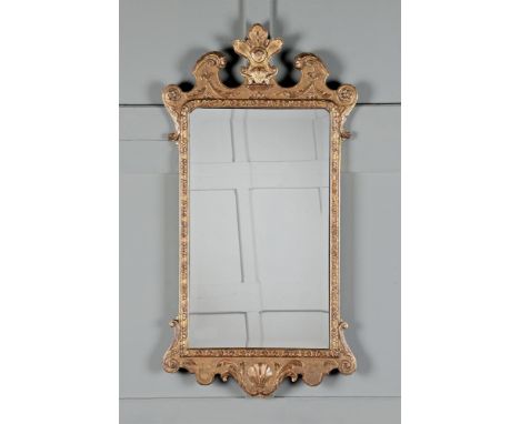 A GEORGE I GILTWOOD MIRROR CIRCA 1725 114.5cm high, 60cm wide  Condition Report:  Overall there are some scratches, marks, ch