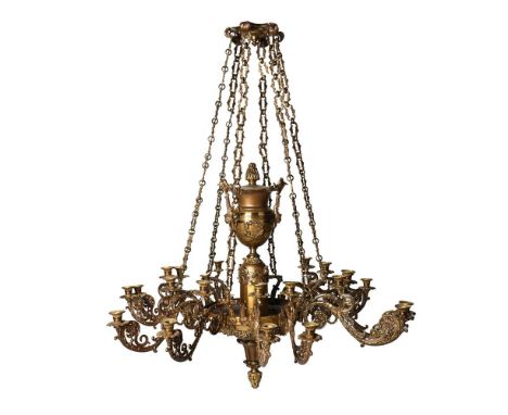 A LARGE GILT METAL AND BRASS TWELVE BRANCH TWENTY FOUR LIGHT COLZA CHANDELIER  FIRST HALF 19TH CENTURY AND LATER  Suspended o