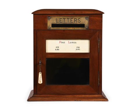 AN EDWARDIAN WALNUT AND BRASS MOUNTED LETTER BOX CIRCA 1905 34cm high, 30cm wide, 24.5cm deep  For another walnut post box of