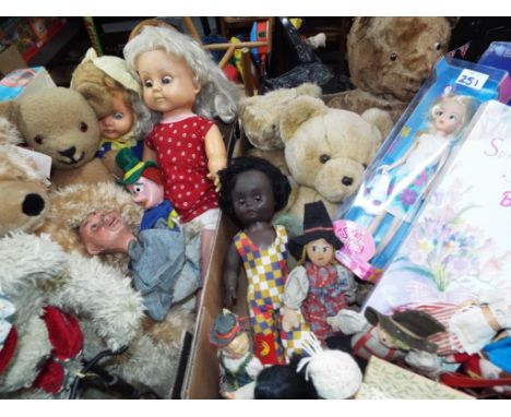 Two boxes containing a mixed lot to include vintage teddy bears and dressed dolls by Palitoy, Russian dolls, puppets and The 