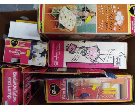 A collection of Pedigree 1970's Sindy Doll Furniture to include a bedside lamp boxed, 2 wardrobes boxed, dressing table boxed