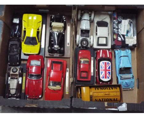 Approximately 14 large scale diecast model motor vehicles to include Burago and Maisto, display dust, unboxed - (2)