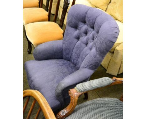 A modern button back armchair 