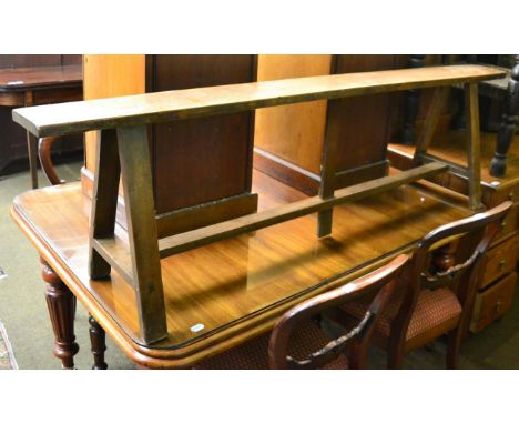 A 19th century French form/bench on trestle base 