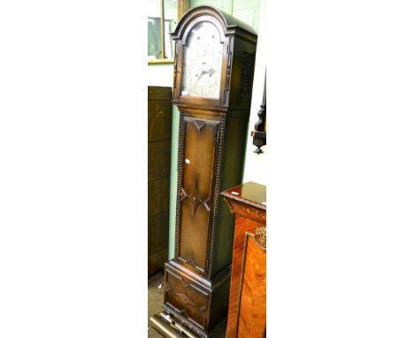 An early 20th century chiming longcase clock, arched silvered brass dial with two subsidiary dials for chime/silence, chime s