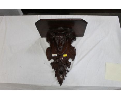 Mahogany wall bracket with carved deer head, width 36 cm, height 38 cm 