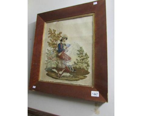 A framed Victorian woolwork of a Gentleman hunter/poacher smoking a pipe.