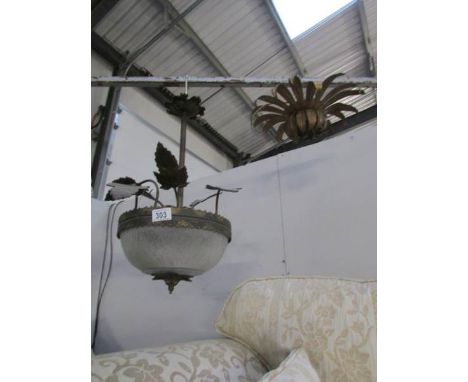An old glass and metal ceiling light