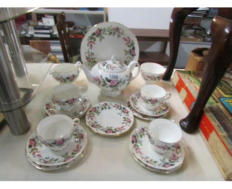 A 16 piece Wedgwood Hathaway Rose tea set comprising tea pot, milk jug, sugar bowl, sandwich plate, 4 tea cups, 4 saucers and