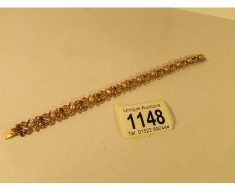 A ladies gold bracelet set with pearl and stamped with German hall mark, total weight 19 grams