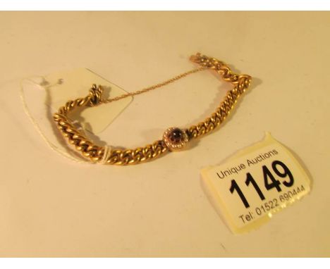 A ladies gold bracelet set with ruby and seed pearls and with German hall mark, total weight approximately 15 grams