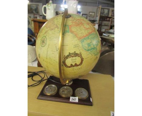 An illuminating desk globe with barometer, thermometer and hygrometer.