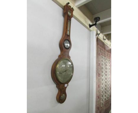 A mahogany banjo barometer.