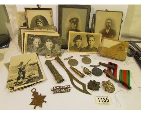 A collection of WW2 medals, photographs etc.,