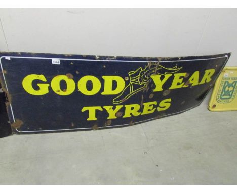 A large Goodyear enamel sign.