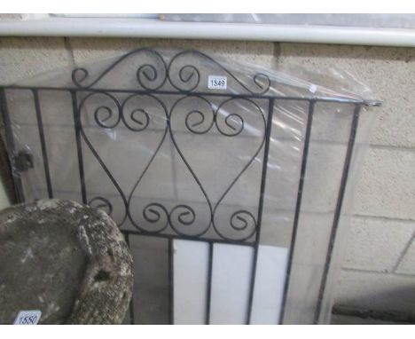 A new wrought iron gate.