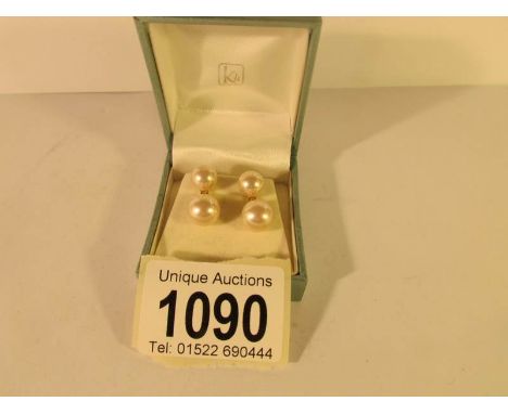 A pair of pearl earrings set in 9ct gold