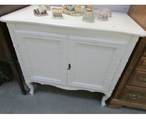 A white painted side cabinet