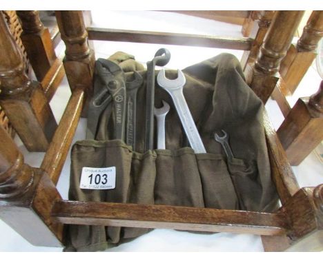 A tool roll containing some Mercedes Benz tools