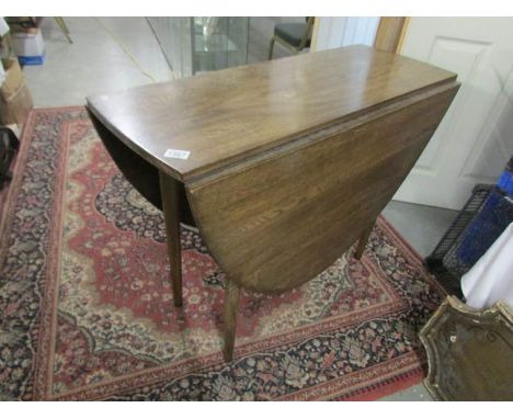 A period oak gate leg table.
