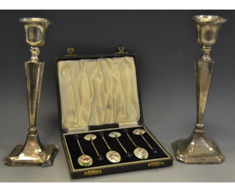 A set of six silver and enamel coffee spoons, the enamelled backed bowls depicting English wild flowers, coffee bean terminal