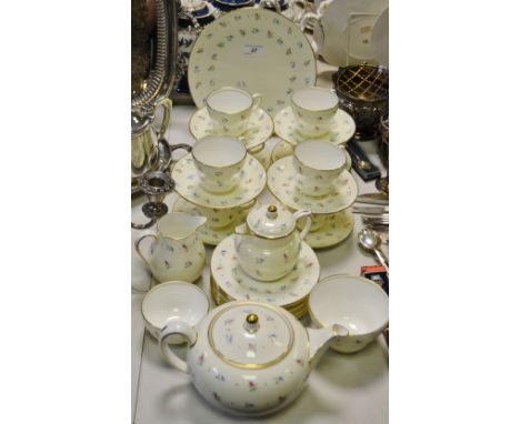 A Wedgewood tea service for eight comprising teapot, cups, saucers and tea plates, sucrier, milk jug, hot water, cake plate