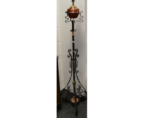 A Victorian wrought iron telescopic standard oil lamp converted to electric.