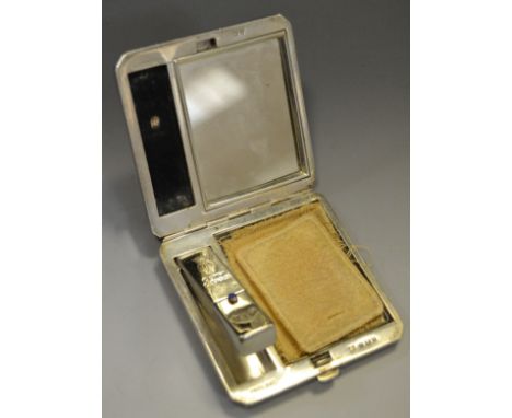 An Art Deco silver compact with integrated lipstick, Birmingham 1938, engine turned decoration. 7cm x 7cm. Net 96.8g (3.11ozt