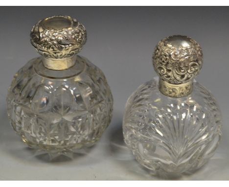 An Edwardian silver mounted globular scent bottle, William Hutton & Sons Ltd, Birmingham 1904; another, London 1904 (2)