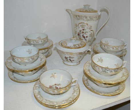 A Veritable Porcelaine de Limoge tea service, comprising  teapot, sucrier, ten cups and saucers transfer printed with Golden 