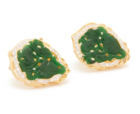 A PAIR OF CARVED JADE AND DIAMOND CLIP EARRINGS
Set in 20k yellow gold with carved foliate decoration and a surround of diamo