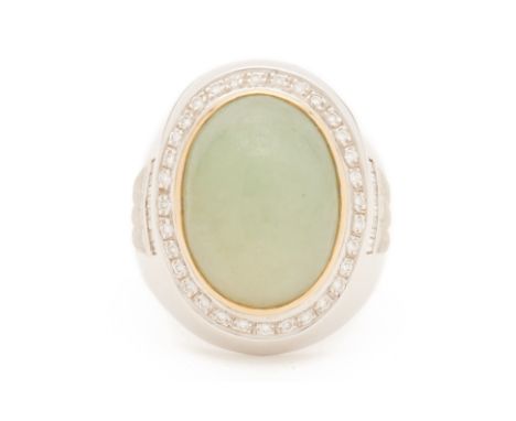 A MEN'S JADE AND DIAMOND RING
Set in 18k white gold, the oval jade cabochon within a border of round brilliant cut diamonds
U