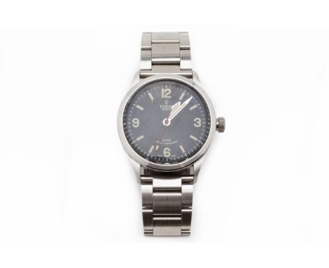 A TUDOR HERITAGE RANGER STAINLESS STEEL BRACELET WATCH
Stainless steel case and original Tudor bracelet, black dial with Arab