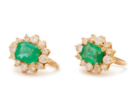 A PAIR OF EMERALD AND DIAMOND CLUSTER EARRINGS
Set in 14k yellow gold, the central step cut emerald with a round brilliant cu