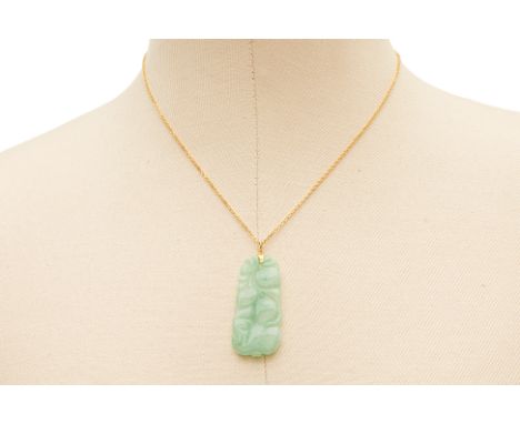 A CARVED JADE PENDANT ON CHAIN
With carved lotus decoration, the chain 22k yellow gold 
The clasp marked '916'
Chain 41cm lon