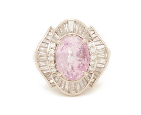 A PINK SAPPHIRE AND DIAMOND RING
Set in platinum, the central oval mixed cut pink sapphire within a radiating surround of rou