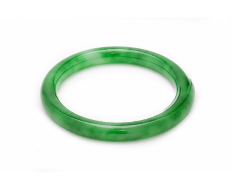 A JADE BANGLE
Of mottled green colour, with box
7.3cm diameter
37g
Condition: For condition reports and further images, pleas