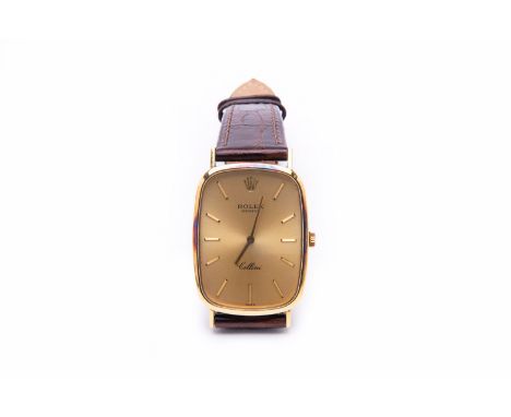 A ROLEX CELLINI GOLD WRITSTWATCH
Circa 1980
18K gold case, rounded rectangular gilt dial, baton hour markers, manual wind mov