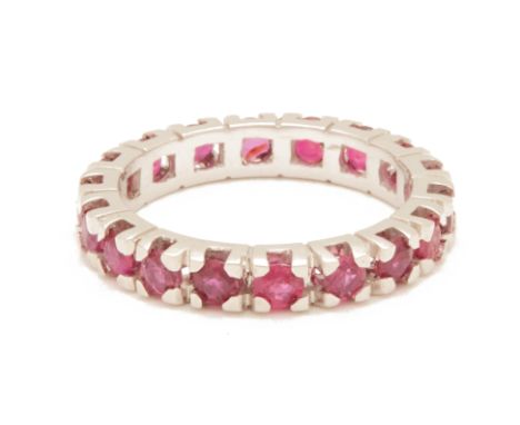 A RUBY FULL ETERNITY RING
Set in 18k white gold
US ring size 5.5
3g
Condition: For a condition report or further images, plea