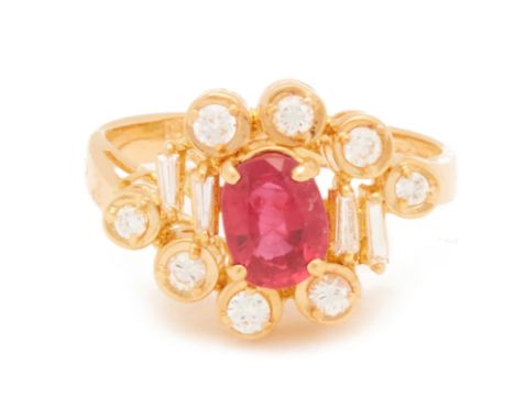 A RUBY AND DIAMOND RING
Set in 18k yellow gold, the central oval cut ruby within a surround of round brilliant and tapered ba