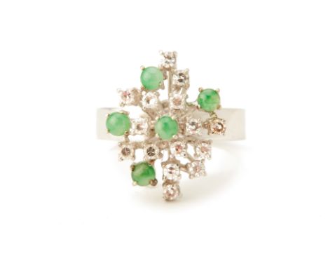 A WHITE GOLD, JADE AND DIAMOND RING
18k white gold, set with round brilliant cut diamonds and circular jade cabochons
Marked 