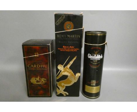 Two bottles of whisky and a cognac, comprising a 70cl 12yr old boxed Cardhu single malt, a tubed 35cl Glenfiddich 12yr old si