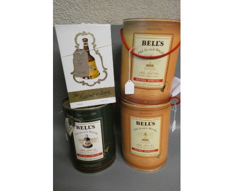 Four boxed Bell's whisky decanters, comprising a 75cl and a 37.5cl Extra Special, a 70cl Christmas 1991 and a 13 1/3 fl. ozs.