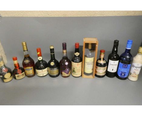 Twelve bottles of mixed alcohol and cognac, comprising a 680ml Courvoisier Luxe cognac, a 70cl Raynal &amp; Cie three barrels