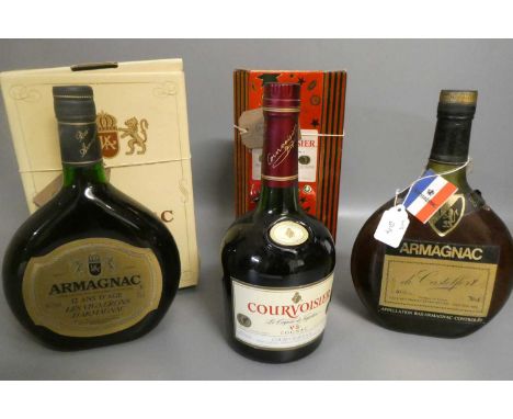 Three bottles of cognac &amp; armagnac comprising a boxed Courvoisier VS cognac, a boxed 12yr old Armagnac, Les Vignerons, an