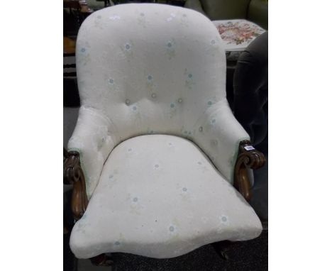 Victorian walnut framed button back upholstered armchair.