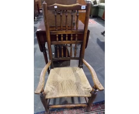 Elm rush seated ladder back low armchair.