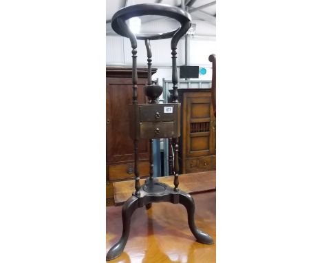 19th Century wash bowl stand, the moulded circular bowl recess on turned supports, with canted triangular shelf beneath, fitt