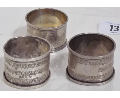 Three engine turned napkin rings. 